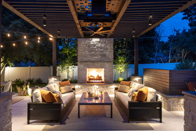Patio - mid-sized modern backyard tile patio idea in Denver with a fireplace and a pergola