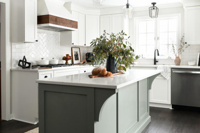 Example of a large transitional brown floor eat-in kitchen design in Other with an undermount sink, white cabinets, quartz countertops, white backsplash, subway tile backsplash, stainless steel appliances, an island and white countertops