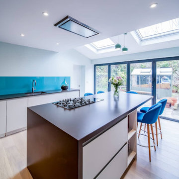 A Contemporary Grey Kitchen with Vibrant Blue Accents