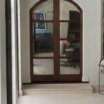 Arched Pocket Doors with Antique Mirror