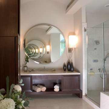 Large Circular Mirror Dominates Master Bath Vanity