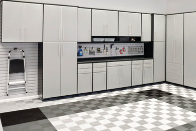 Garage workshop - mid-sized modern attached one-car garage workshop idea in Toronto