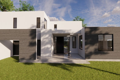 Ejemplo de fachada de casa negra grande de dos plantas con revestimiento de madera, tejado plano y panel y listón