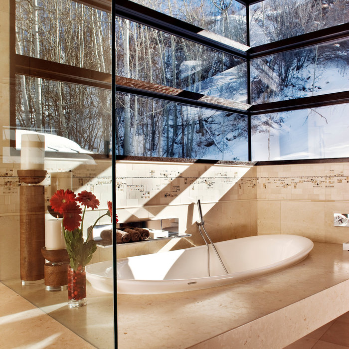 Master bathrooms are surrounded by windows filling the rooms with light and bringing the Aspen landscape indoors. Soaking tubs and steam showers add to the luxury.
