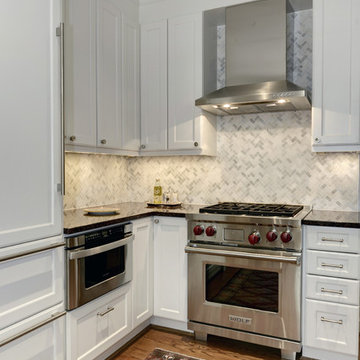 Herringbone marble backsplash and drawer microwave