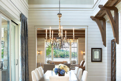 Example of a mid-sized transitional dark wood floor and brown floor kitchen/dining room combo design in Orange County with white walls and no fireplace