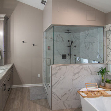 Traditional Master Bathroom With Warm Tones, Stand Alone Tub & Walk In Shower
