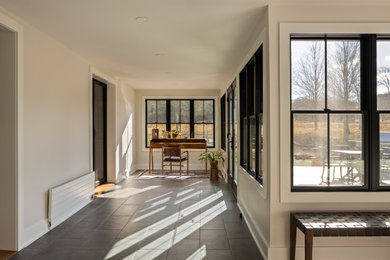 Example of a country sunroom design in Other