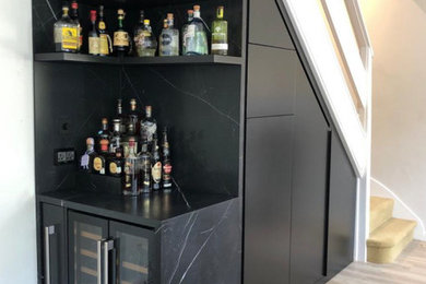 Inspiration for a modern home bar remodel in London