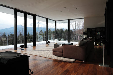 Photo of a modern living room in Tokyo Suburbs with medium hardwood floors.
