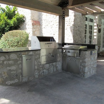 Stone Outdoor Kitchen Addition with Fireplace and Hasty-Bake Charcoal Grill