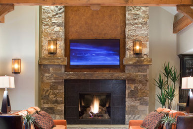 Living room - rustic living room idea in Denver with a standard fireplace and a tile fireplace
