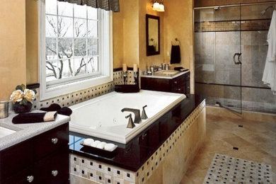 Elegant master bathroom photo in Dallas with an undermount sink, flat-panel cabinets, dark wood cabinets, granite countertops, a two-piece toilet and yellow walls