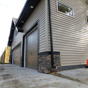 Detached 3 Car Garages with man door to back lane and shop
