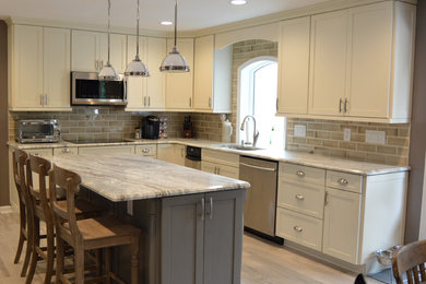 This is an example of a medium sized modern kitchen in Baltimore.