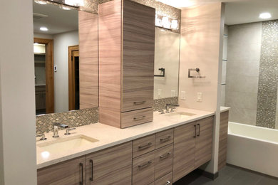 Bathroom - large contemporary beige tile and porcelain tile ceramic tile, brown floor and double-sink bathroom idea in Other with flat-panel cabinets, beige walls, an undermount sink, quartz countertops, a hinged shower door, white countertops and a floating vanity