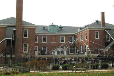 Example of a large urban two-story brick exterior home design in Boston