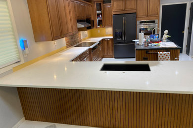Inspiration for a kitchen in Chicago with engineered stone countertops and white worktops.