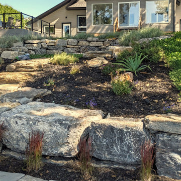 Waterfront backyard landscaping and sunroom extension