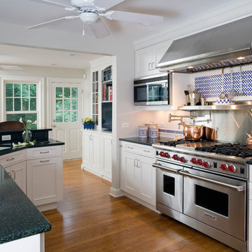 White Recessed Panel Cabinet Kitchen with Wolf Appliances and Ceramic Backsplash