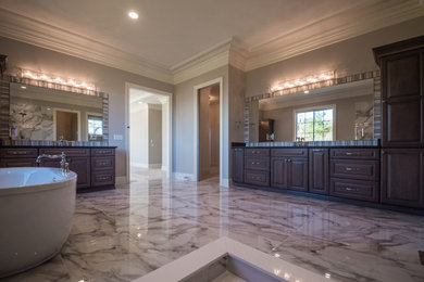 Large transitional master double-sink bathroom photo in Other with raised-panel cabinets, brown cabinets, an undermount sink, quartz countertops and a built-in vanity