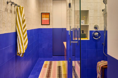 Inspiration for a mid-sized contemporary blue tile bathroom remodel in New York with beige walls and a hinged shower door