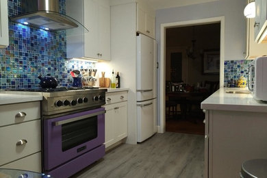 Enclosed kitchen - small contemporary galley laminate floor and gray floor enclosed kitchen idea in San Francisco with an undermount sink, shaker cabinets, white cabinets, quartz countertops, metallic backsplash, metal backsplash, white appliances and no island