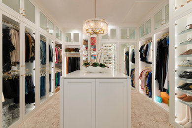 Inspiration for a large transitional gender-neutral carpeted and beige floor walk-in closet remodel in Dallas with shaker cabinets and white cabinets