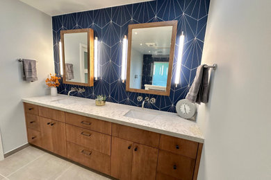 Mid-sized trendy master blue tile porcelain tile, gray floor and double-sink doorless shower photo in San Francisco with flat-panel cabinets, medium tone wood cabinets, white walls, an undermount sink, quartz countertops, white countertops and a built-in vanity