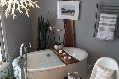 Minimalist master ceramic tile freestanding bathtub photo in Milwaukee with gray walls
