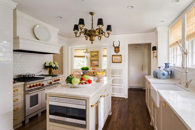 Inspiration for a transitional separate kitchen in Portland with a farmhouse sink, shaker cabinets, beige cabinets, white splashback, subway tile splashback and stainless steel appliances.