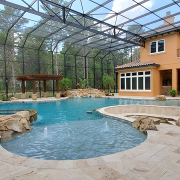 Resort Inspired Pool with Grotto and Sunken Firepit Lounge