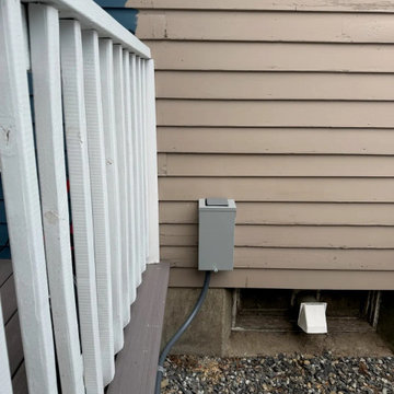 A dedicated spa disconnect installed within sight of the hot tub, as code requir