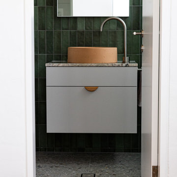 Emerald Green bathroom with custom vanities