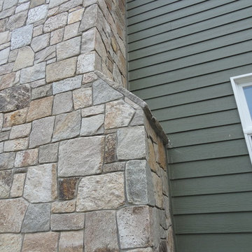 Combining Colonial Tan Natural Stone with Olive Green Siding