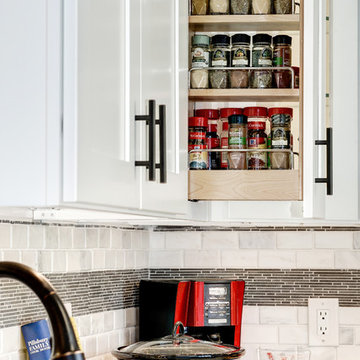 White Kitchen Remodel with Colonial White Granite and Stainless Steel Appliances
