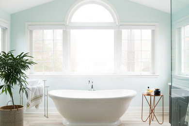 Inspiration for a large transitional blue tile and glass tile ceramic tile and beige floor bathroom remodel in Philadelphia with shaker cabinets, brown cabinets, a two-piece toilet, blue walls, an integrated sink, quartz countertops and a hinged shower door