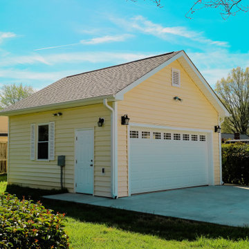 Side Angle of Detached Garage with Fresh Landscaping