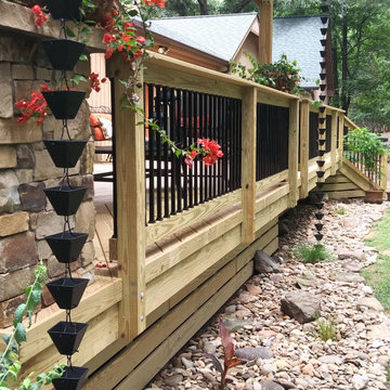 Raleigh Rustic Porch with Rain Chains Instead of Downspouts