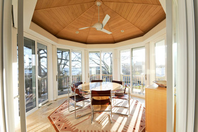 Inspiration for a mid-sized contemporary back porch remodel in Minneapolis with a roof extension