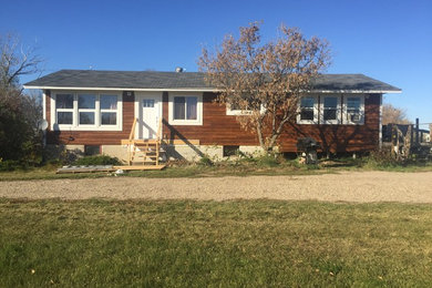 Example of a large classic exterior home design in Other