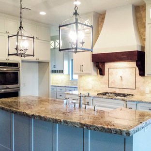 Rustic kitchen pantry remodeling - Example of a mountain style medium tone wood floor kitchen pantry design in Oklahoma City with a farmhouse sink, flat-panel cabinets, white cabinets, granite countertops, beige backsplash, stone tile backsplash, stainless steel appliances and an island