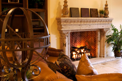 Design ideas for a mediterranean living room in Dallas with a standard fireplace and a stone fireplace surround.