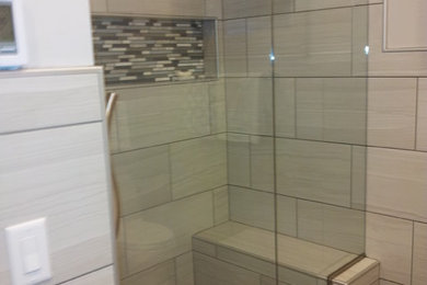 Bathroom - contemporary 3/4 gray tile and porcelain tile ceramic tile bathroom idea in Minneapolis with shaker cabinets, gray cabinets, a one-piece toilet and gray walls