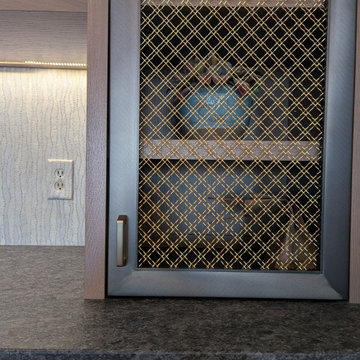 Rift cut white oak bar with custom metal mesh doors and reeded panels
