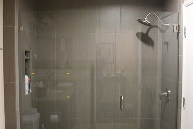 Alcove shower - mid-sized contemporary master gray tile and ceramic tile alcove shower idea in San Diego with a one-piece toilet and gray walls