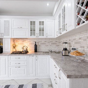 White kitchen cabinets with custom Granite Countertops