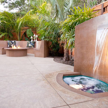 Hawaiian-Style Decorative Concrete Patio w/ Waterfall, Fire Pit & Bench Seating