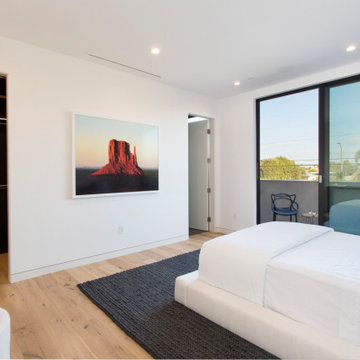 Minimal Bedroom Design with Large Window and Clean Finishes