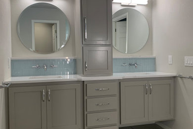 Large transitional master bathroom in Oklahoma City with shaker cabinets, grey cabinets, a curbless shower, blue tile, grey walls, an undermount sink, engineered quartz benchtops, a hinged shower door, white benchtops, a shower seat, a double vanity and a built-in vanity.